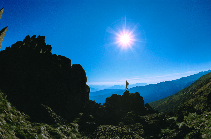 silhouette bushwalker standing on South Ramshead granite tors - Kosciuszko National Park -10